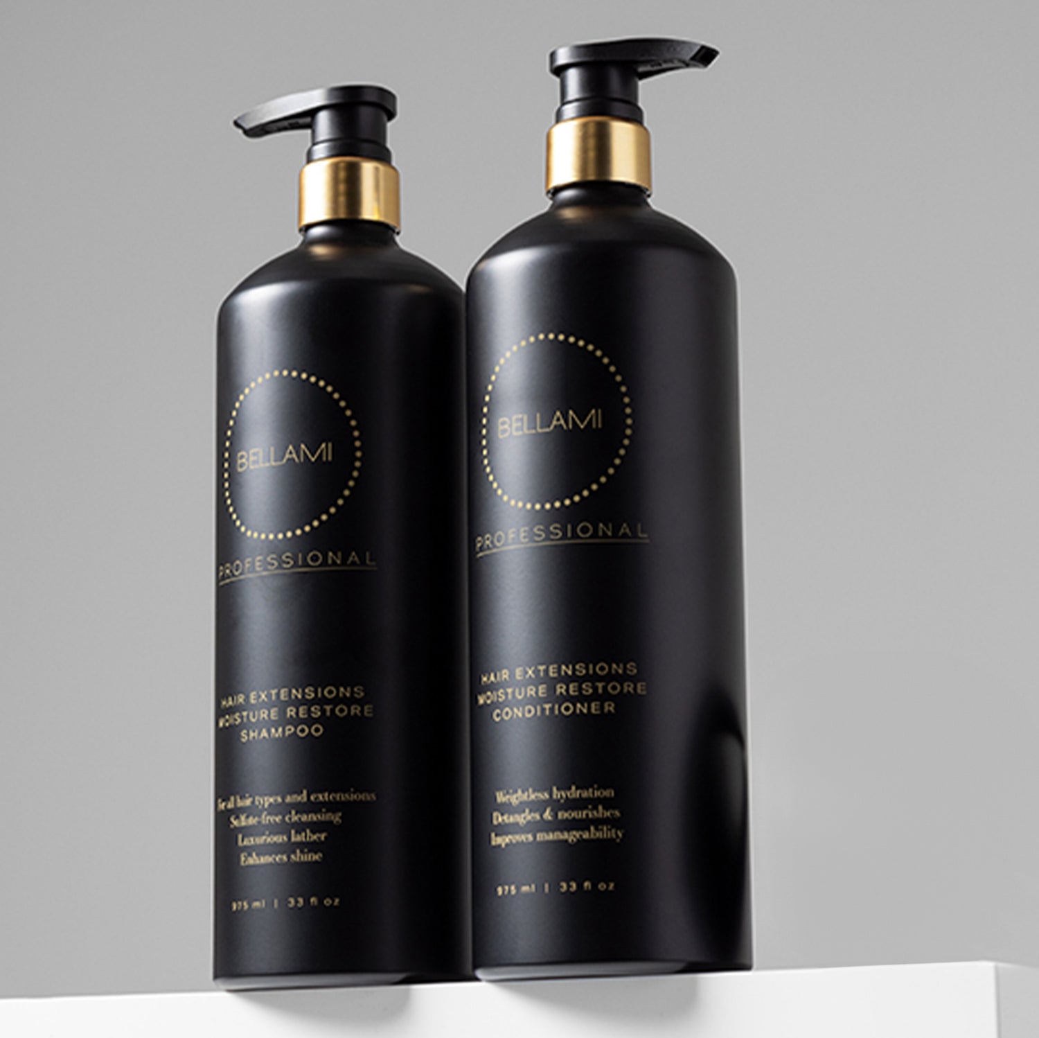Two black bottles of Bellami Moisture Restore Shampoo and Conditioner with gold accents.